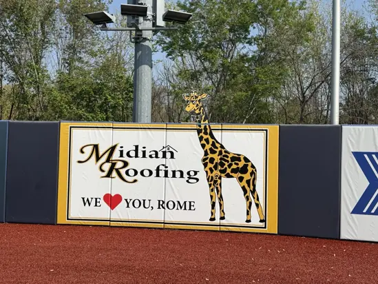 Midian Roofing stadium padding with custom MDO giraffe-head cutout