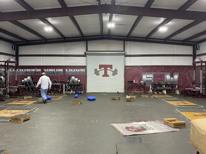 Thomasville Tigers maroon fieldhouse walls wrapped in large-format printed banner material